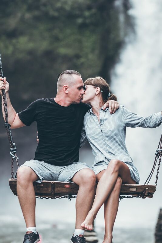Young honeymoon couple swings in the jungle near the waterfall, Bali island, Indonesia. Ubud. (30146462078)